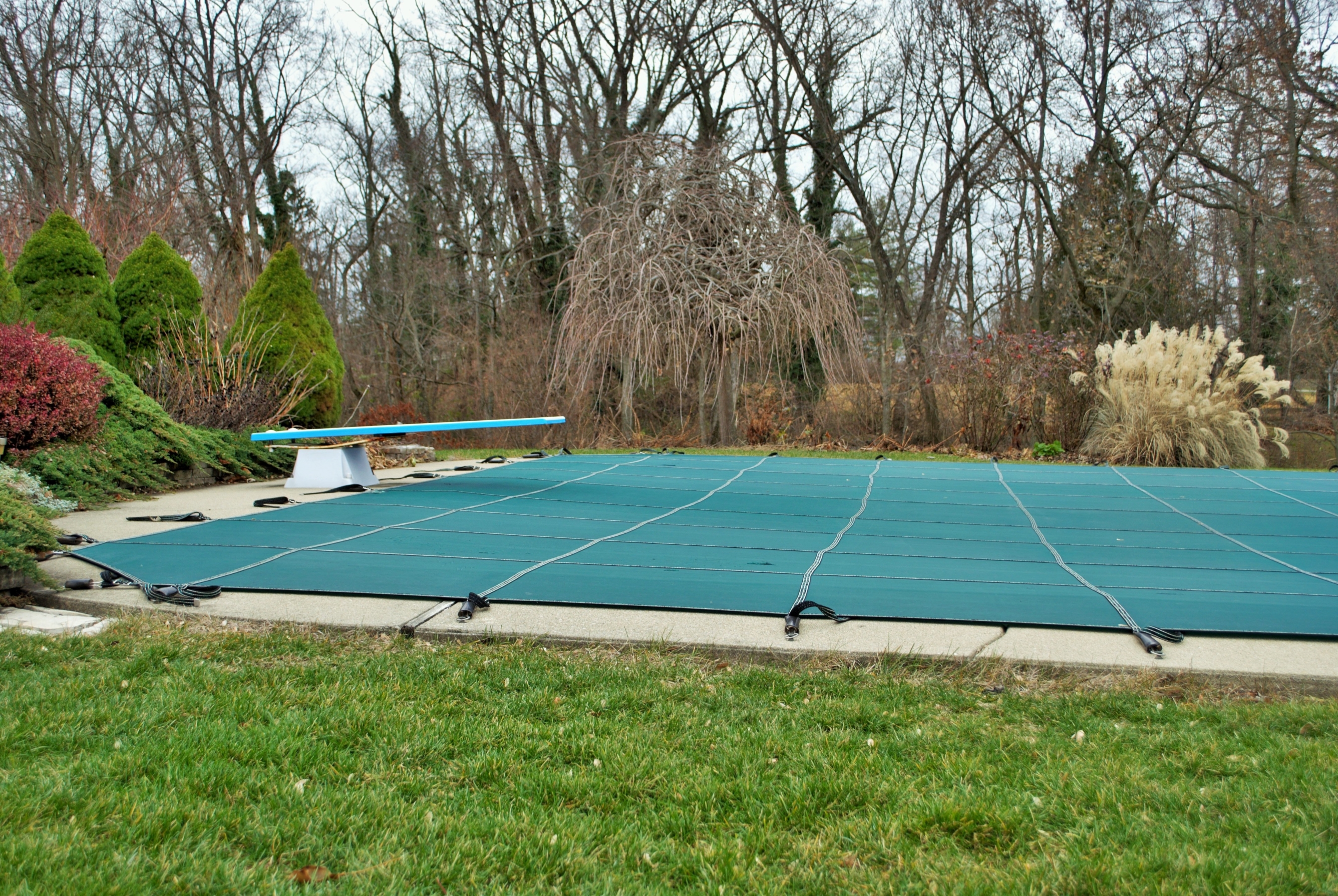 An inground pool closed for winter