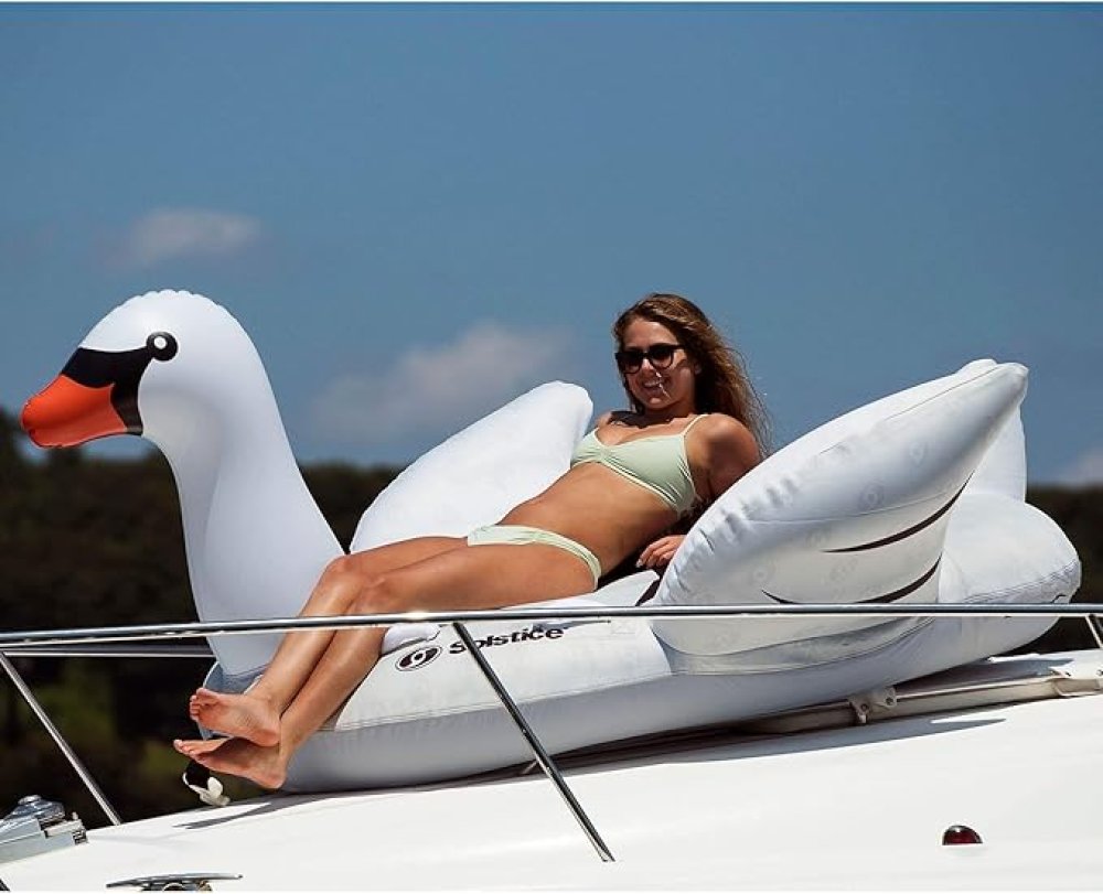 Woman Laying On Lay-On Towable Inflatable Swan