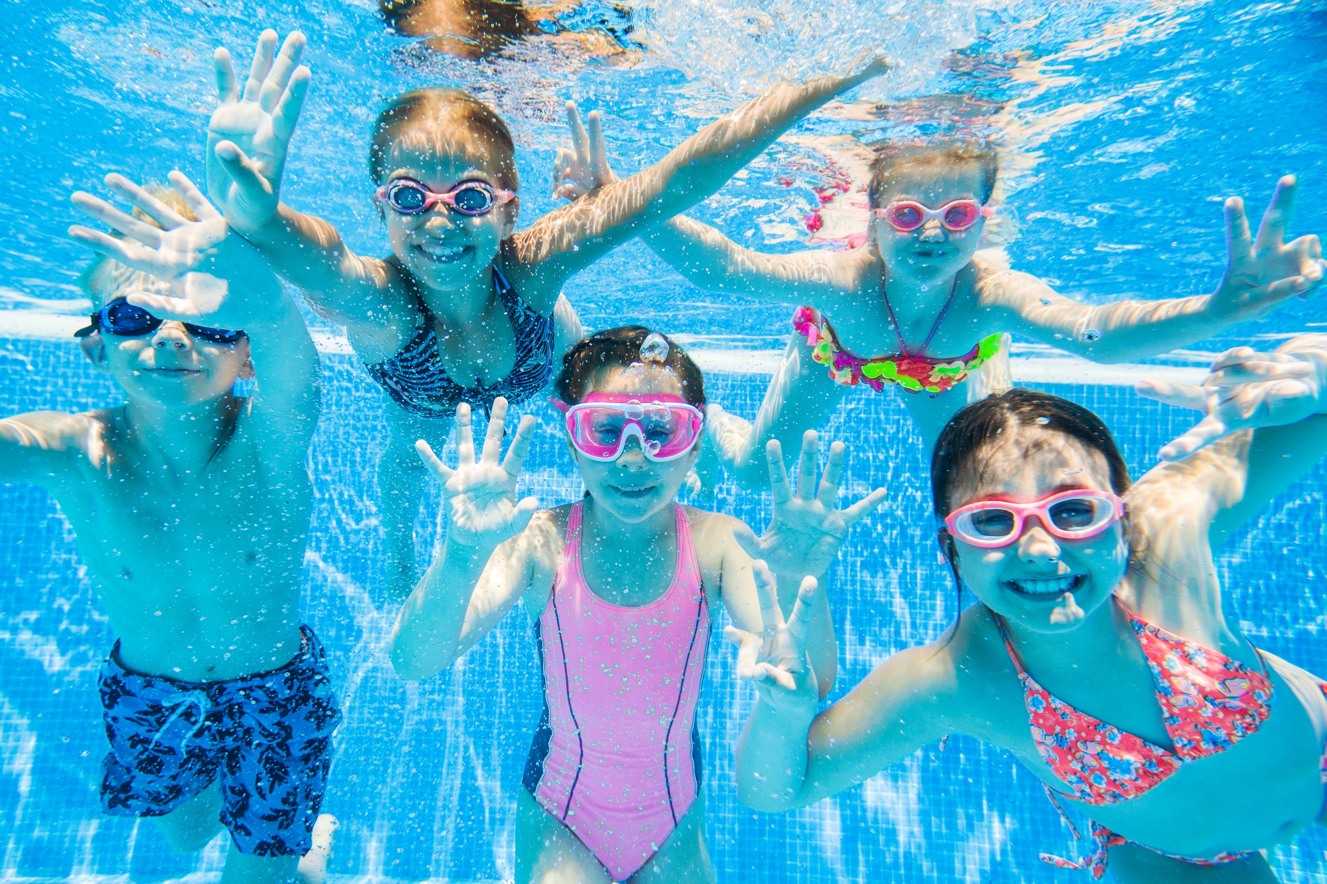 Children having fun in a pool