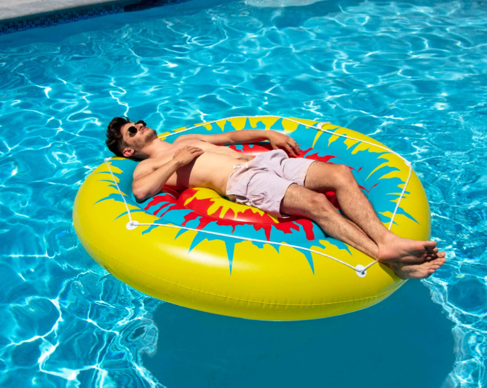 Man On Swimline® Tie Dye Island Inflatable Pool Float