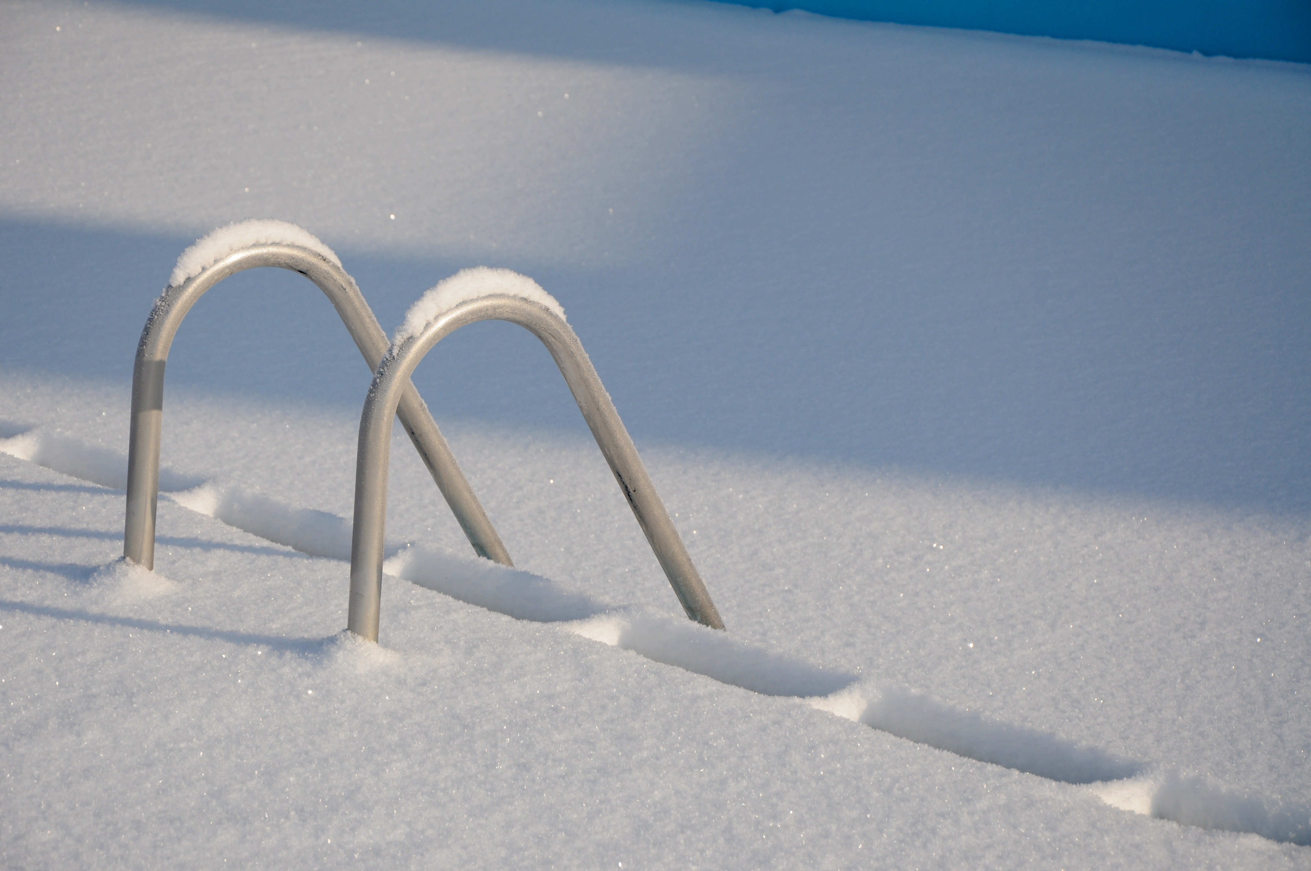 Aninground pool covered in snow