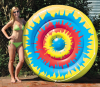 Woman Standing Up Swimline® Tie Dye Island Inflatable Pool Float